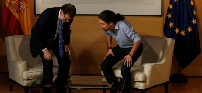 Spanish Prime Minister Mariano Rajoy (L) and Podemos leader Pablo Iglesias talk during their meeting in Madrid, Spain July 12, 2016. REUTERSJavier Barbancho