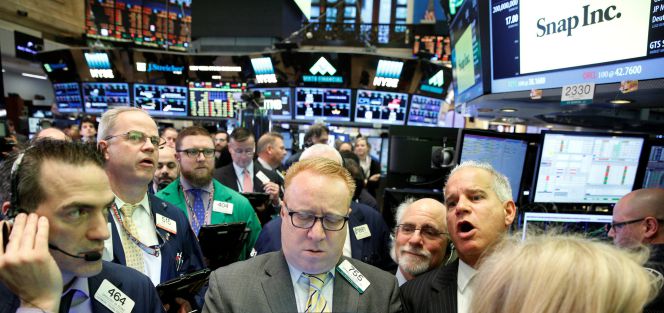 Traders pendientes de la OPV de Snap, el jueves en la Bolsa de Nueva York.