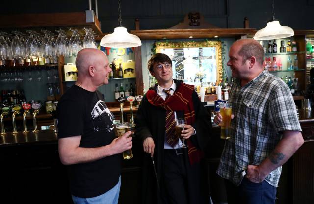 Professional Harry Potter impersonator Luke Williams (C) enjoys a drink at a pub in London, Britain, May 1, 2017. REUTERSNeil Hall SEARCH "HALL POTTER" FOR THIS STORY. SEARCH "WIDER IMAGE" FOR ALL STORIES.