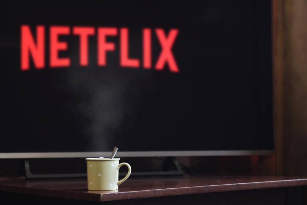Mug with TV in background with Netflix