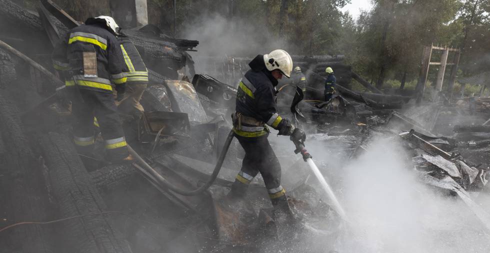Firefighters battle a fire sparked by a Russian missile in the Ukrainian city of Kharkiv.