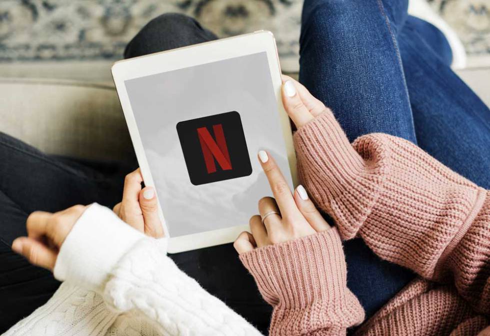 Netflix logo on the screen of a tablet