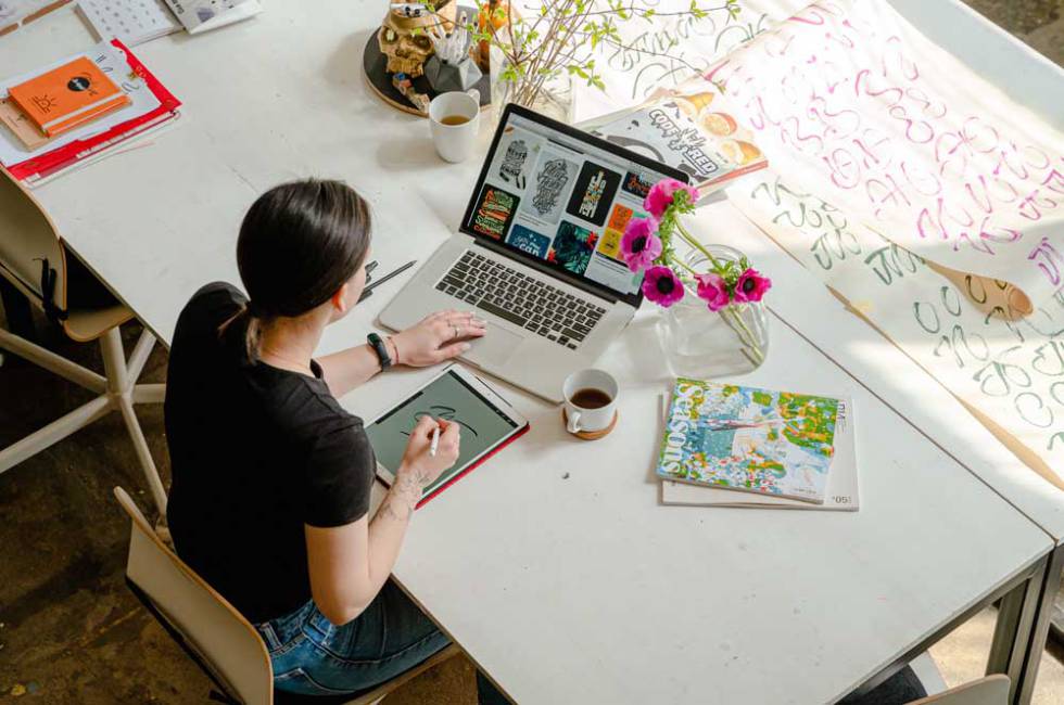 Girl using Apple MacBook at a desk